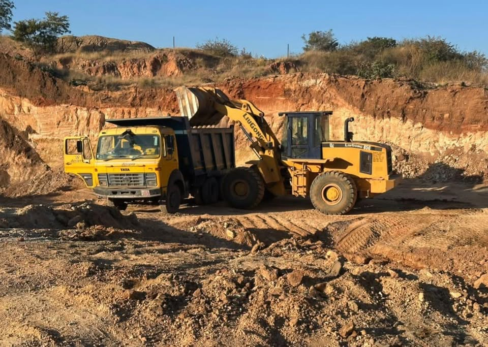 LiuGong wheel loader loading TATA tipper in quarry